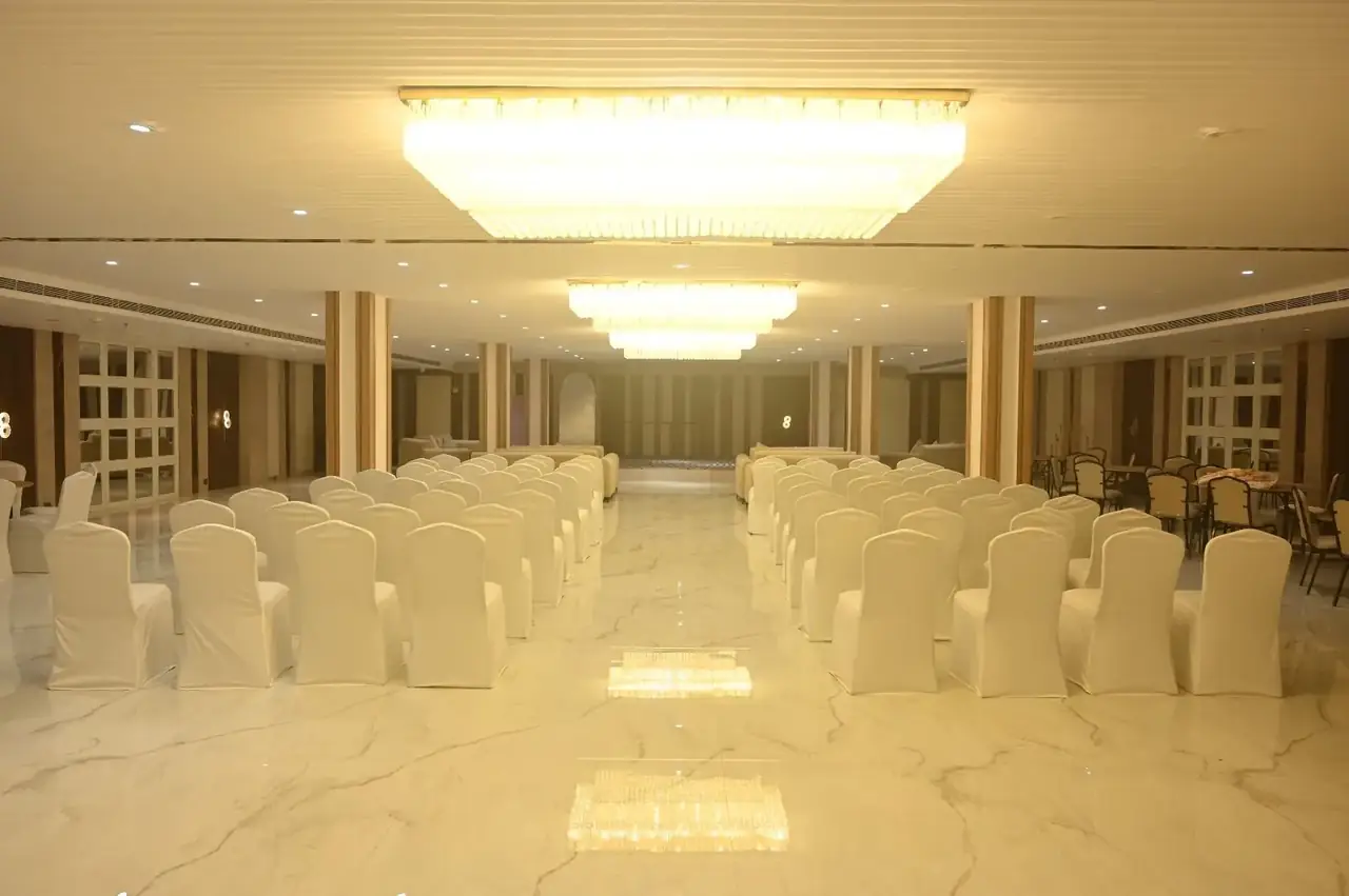 Jalsa banquet hall aisle view under chandeliers